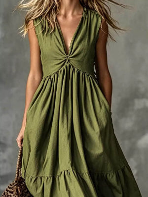Olive green linen blend dress with deep V-neck, knot detail, tiered skirt, and pockets.