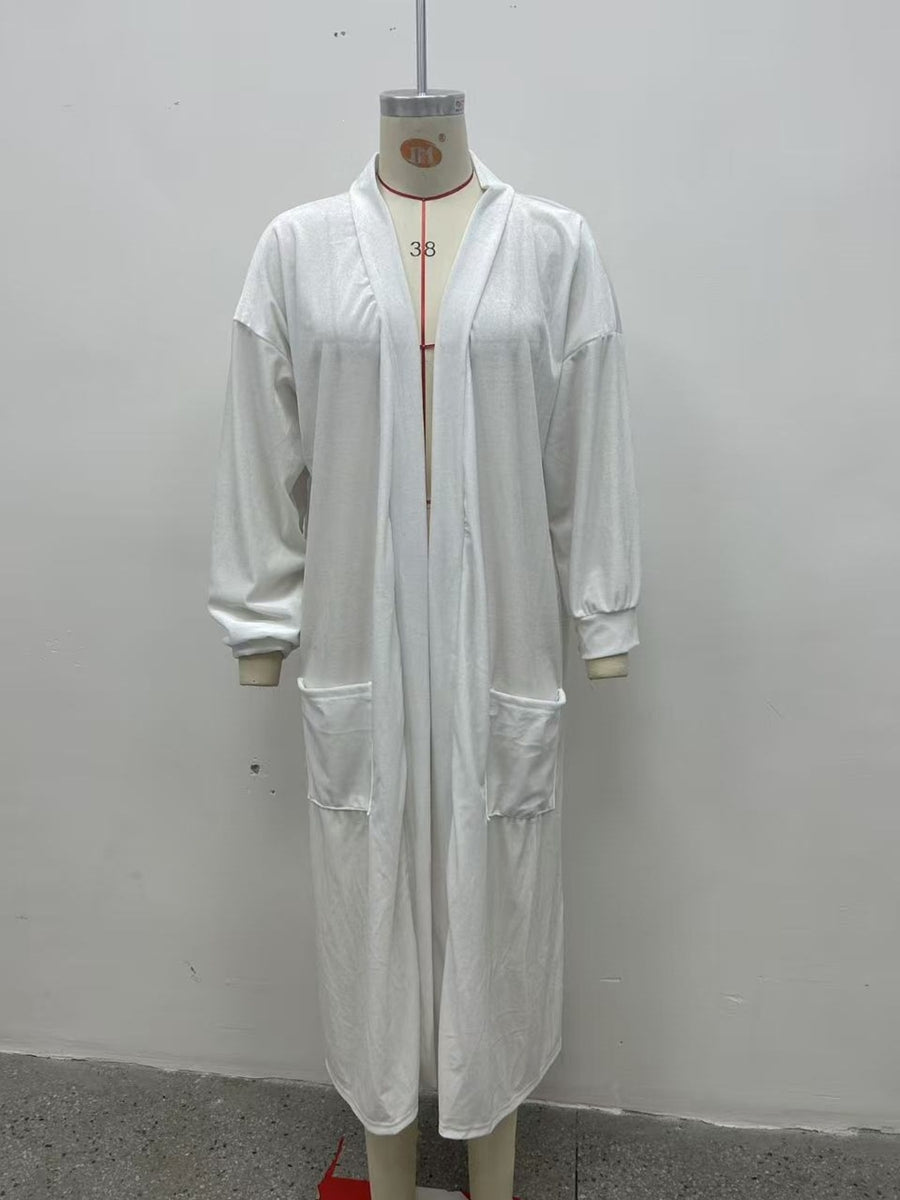 White cardigan featuring pocketed and abstract-print
