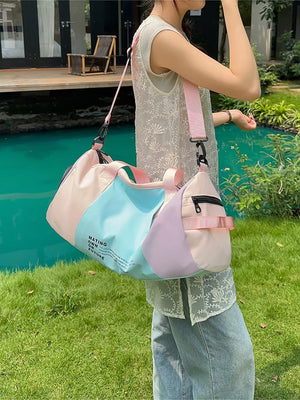 Vibrant pastel nylon duffle bag with color-blocked panels and adjustable strap.