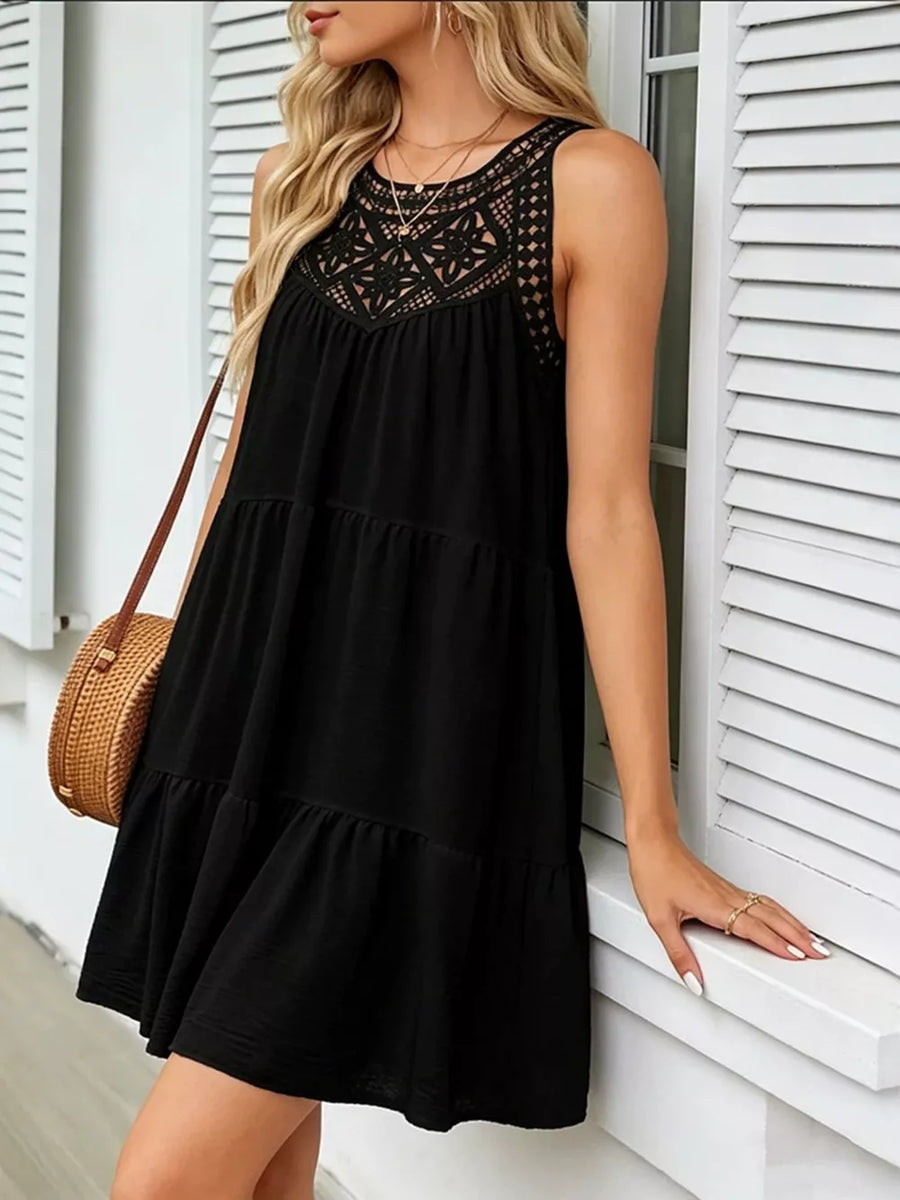 Black tiered dress with lace neckline detail, sleeveless, casual style