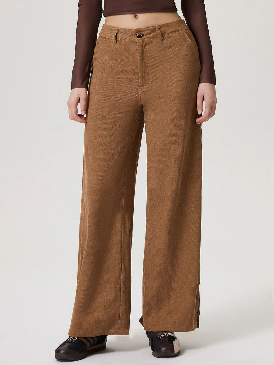 Corduroy wide-leg trousers in camel with a buttoned front.