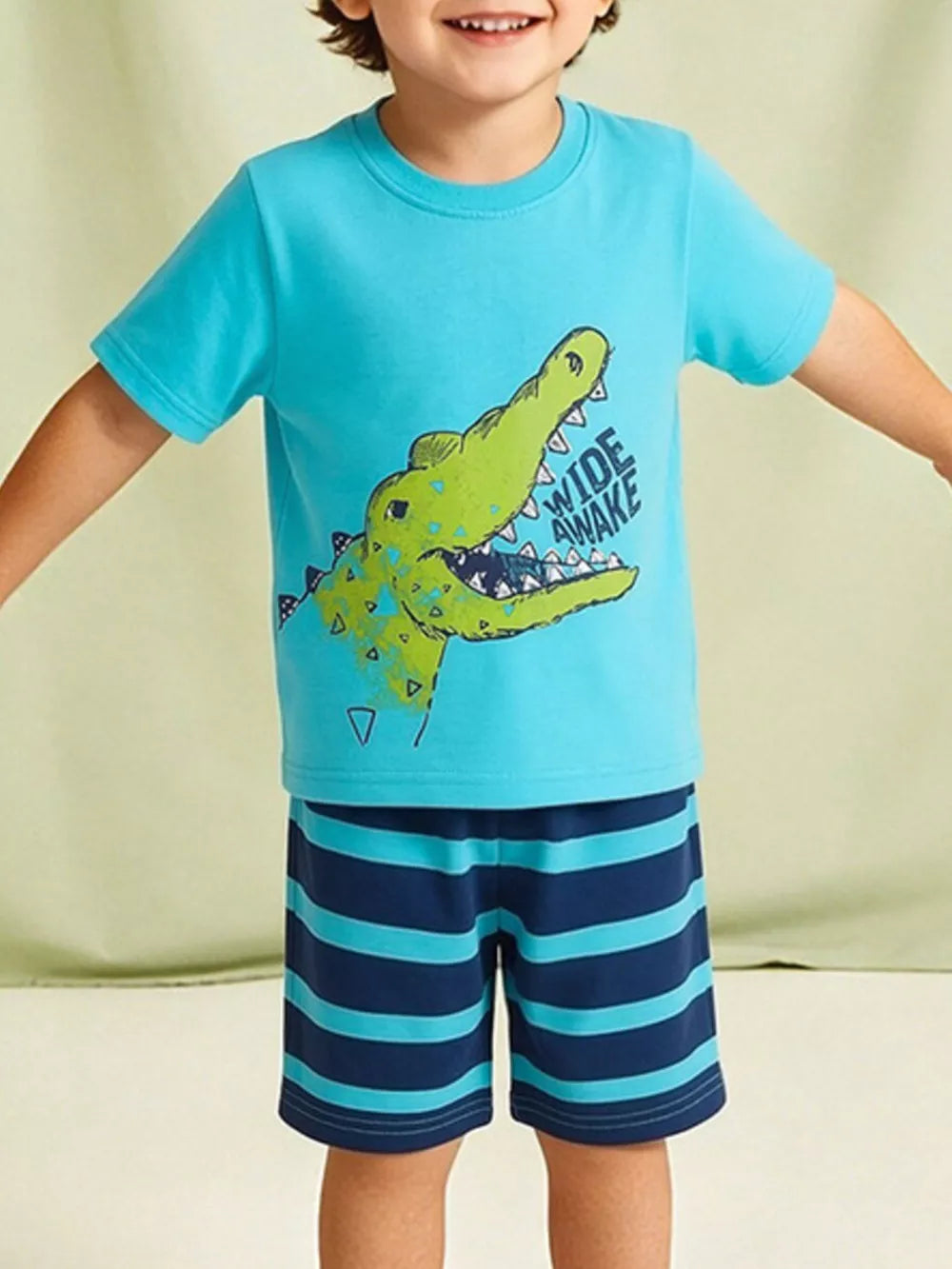 Toddler boys blue cotton t-shirt with crocodile graphic and striped shorts.