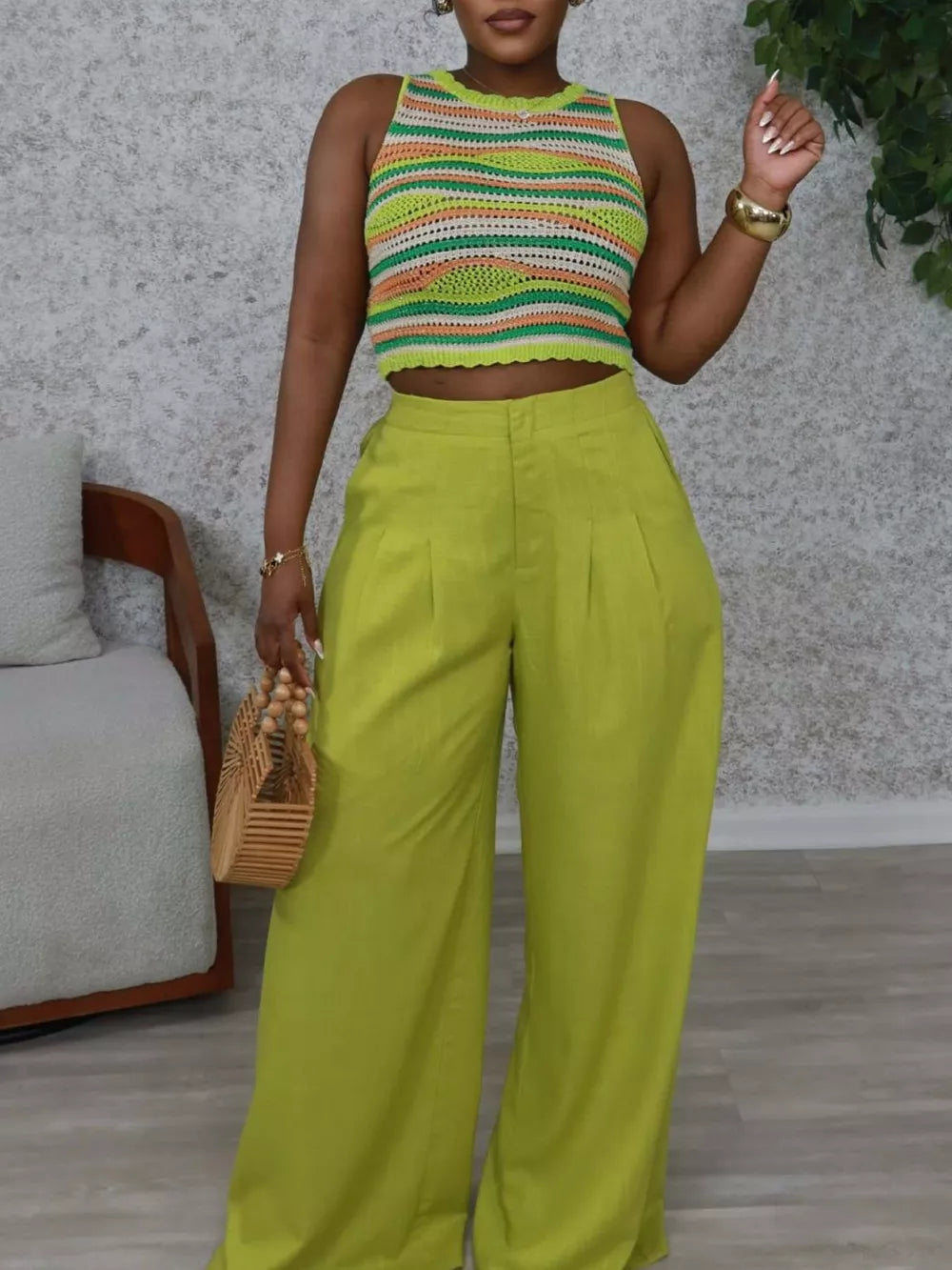 Sophisticated high-waist flowing pants in lime green with a wide leg and subtle pleats.