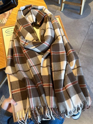 Plaid fringe scarf in taupe with white and red accents, featuring a cozy, heritage-inspired design.