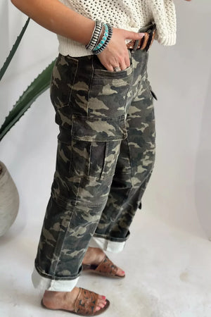 Camo print cargo jeans with multiple pockets and cuffed ankles.