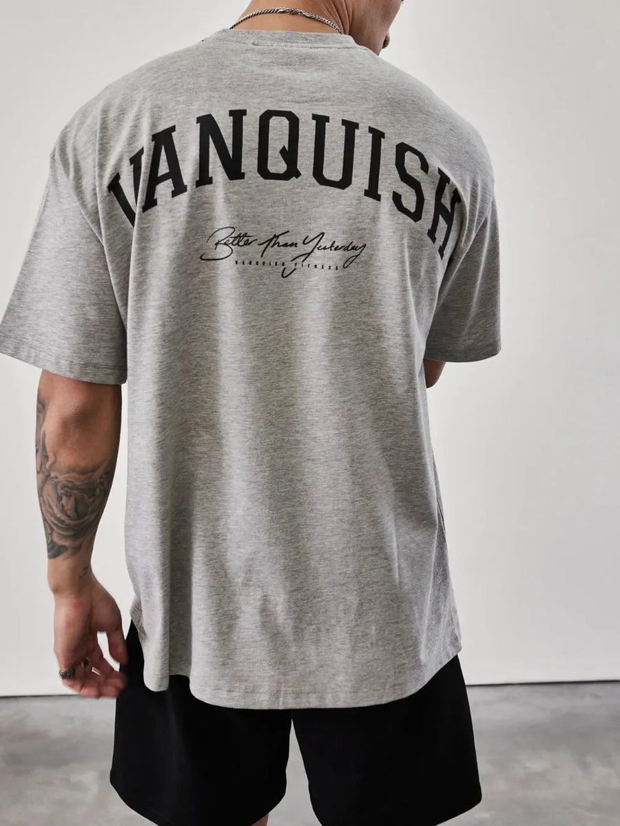 Gray oversized graphic tee with "Vanquish" back print and script text detail.