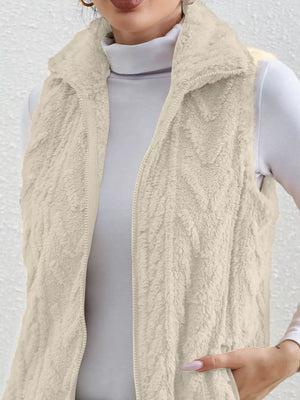 Off-white faux fur zip-up vest with a stand-up collar and textured pattern.