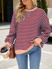 Striped crew neck sweatshirt in royal blue and red with light pink trim and cuffs.