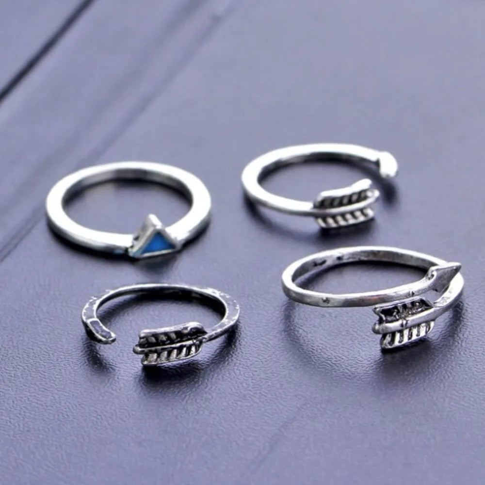 Silver bohemian rings with turquoise triangle and arrow details.