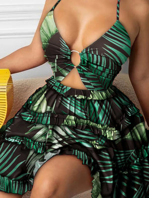 Halter mini dress with cutout and ring detail in a tropical leaf print.