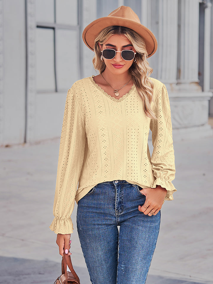 Lemon lace trim eyelet blouse with ruffle cuffs and V-neckline.