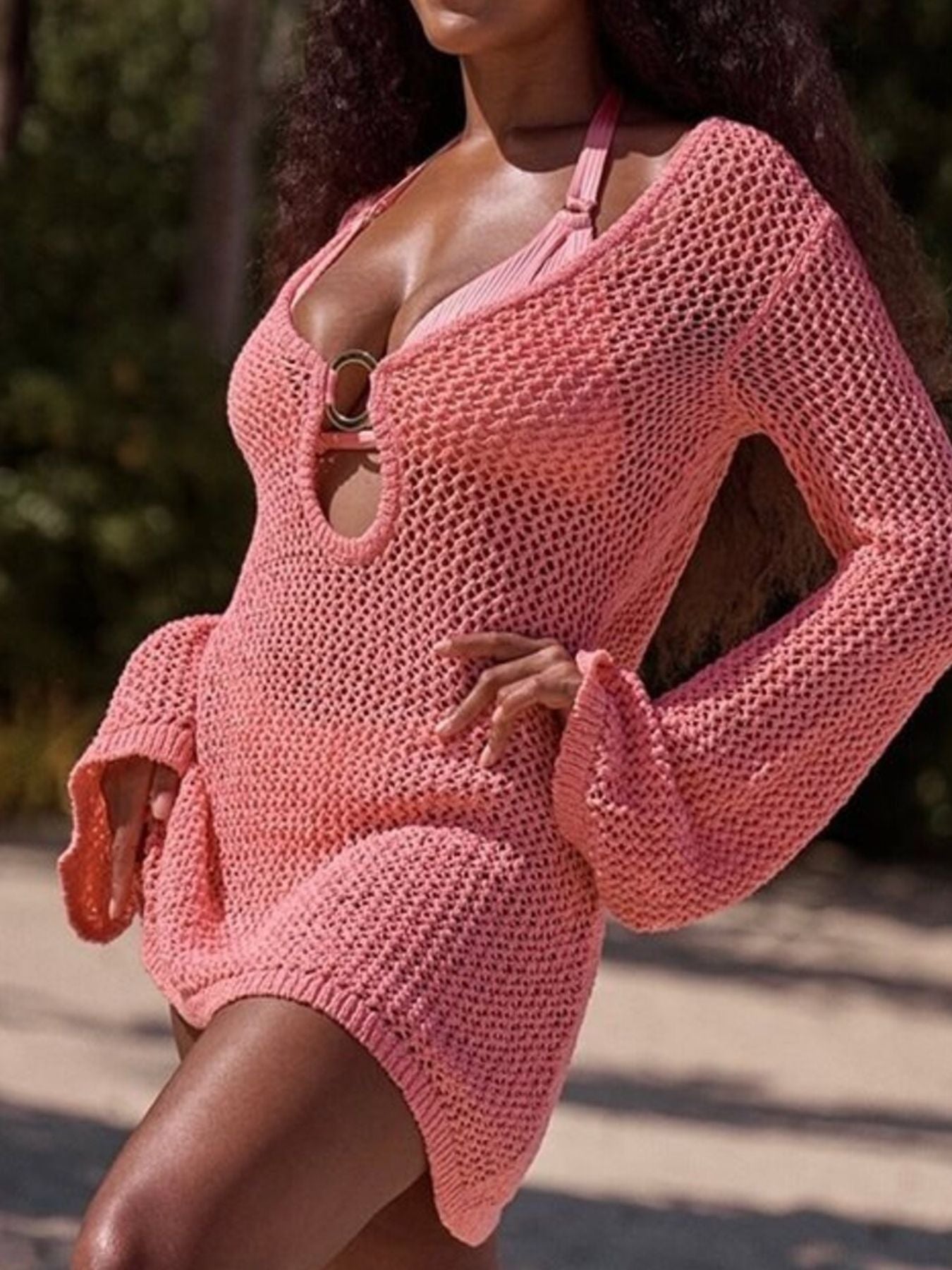 Dusty pink openwork knit cover-up dress with keyhole detail and ring accent.