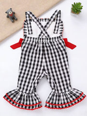 Baby bell bottom jumpsuit in black gingham with red trim and bows.