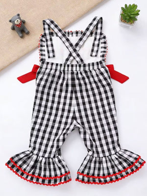 Baby bell bottom jumpsuit in black gingham with red trim and bows.