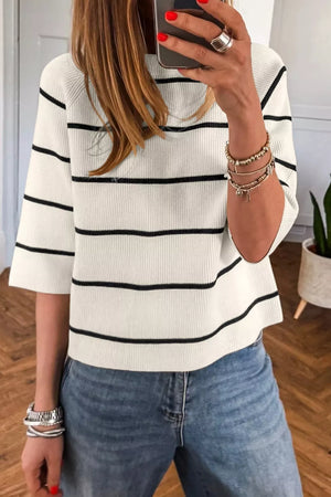 White ribbed knit top with black stripes and elbow-length sleeves.