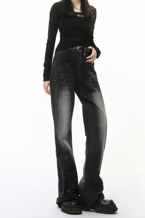Dark wash flare jeans with splatter detail and double waistline.
