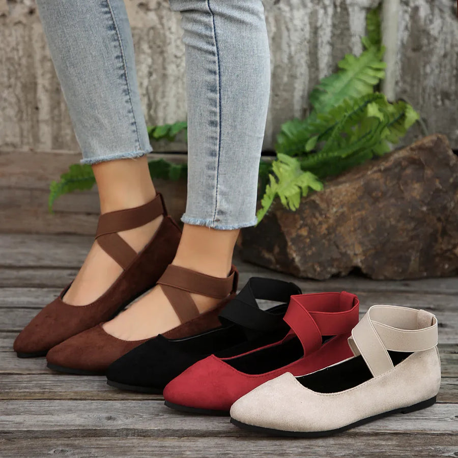 Crisscross strap pointed-toe ballet flats in dark brown, black, deep red, and beige.