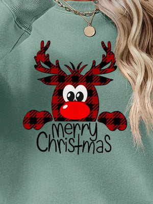 Green crewneck sweatshirt with plaid reindeer graphic and "Merry Christmas" text.