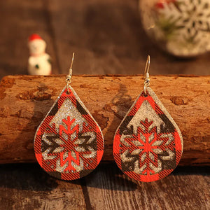 Plaid snowflake drop earrings in deep red with glitter accents.