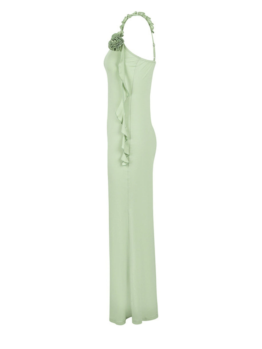 Ruffled mermaid maxi dress in light green with a single shoulder strap and floral detail.