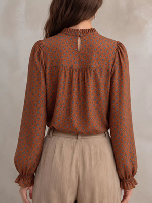 Beige blouse featuring frill and geometric