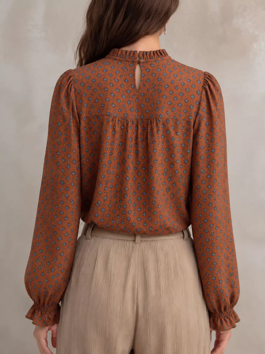 Beige blouse featuring frill and geometric