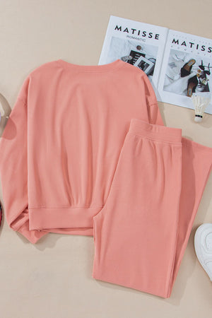 Pink ribbed crewneck sweatshirt and wide leg pants set