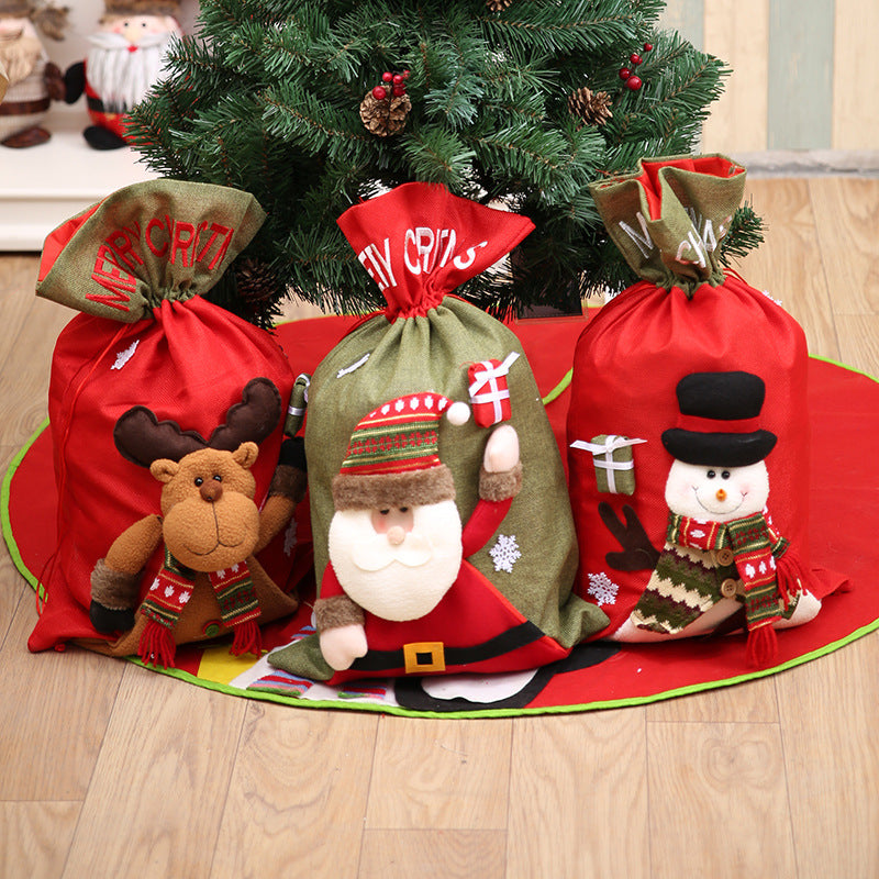 Festive drawstring gift sacks with Santa, snowman, and reindeer designs.