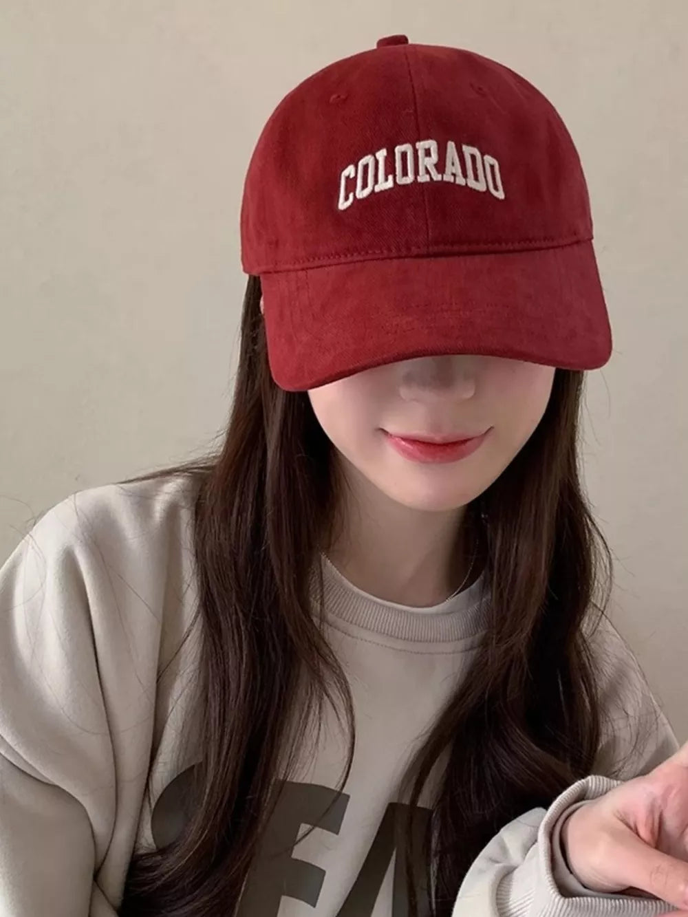 Burgundy cotton baseball cap with embroidered COLORADO text.