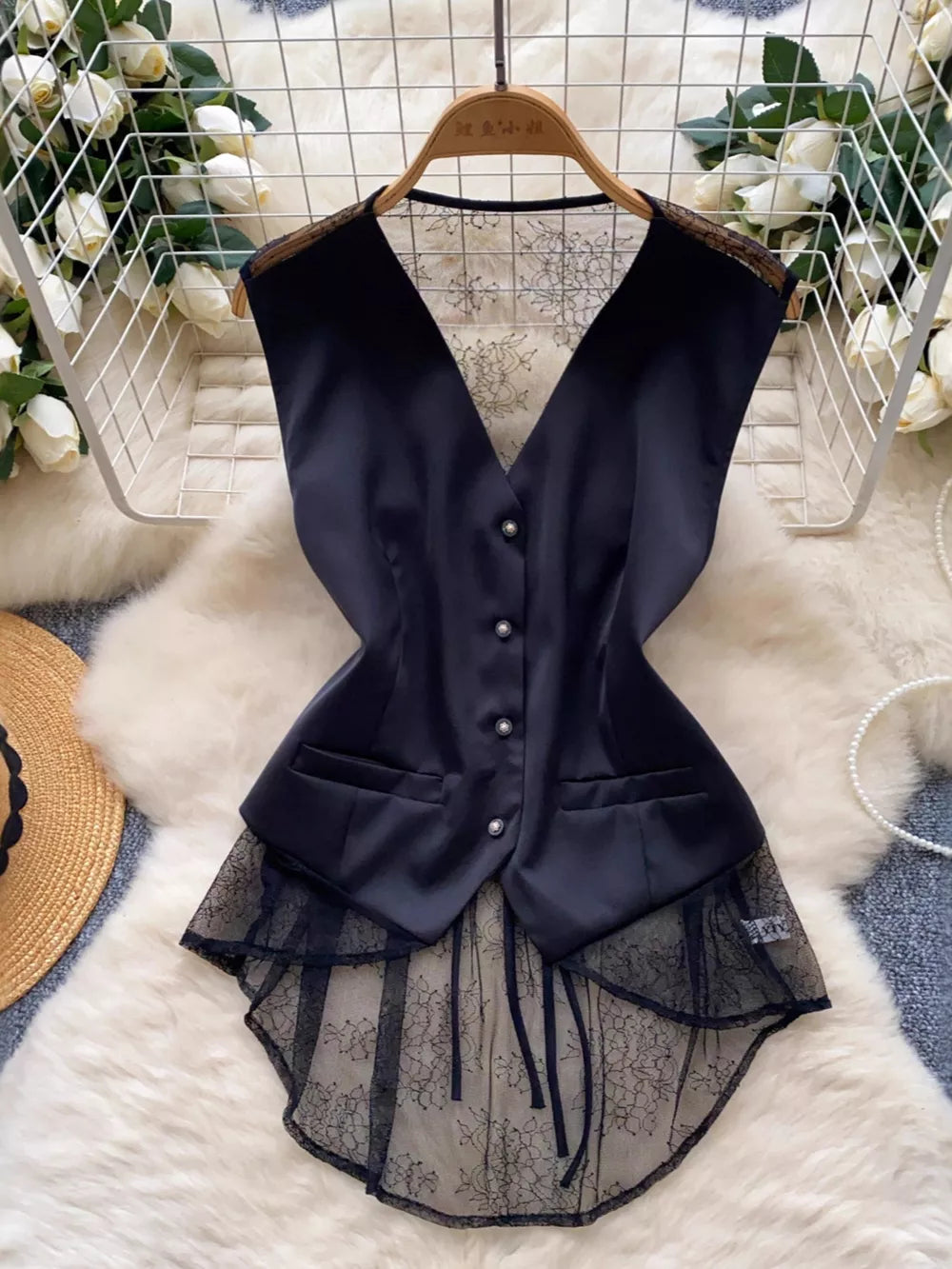 Black button-down vest coat with lace embellishments and sheer lace hem