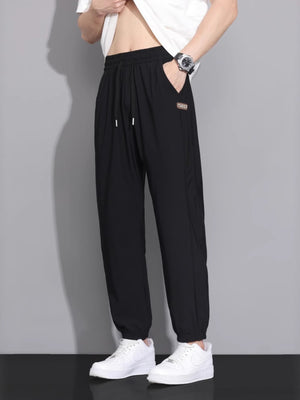 joggers in black featuring drawstring and loose fit