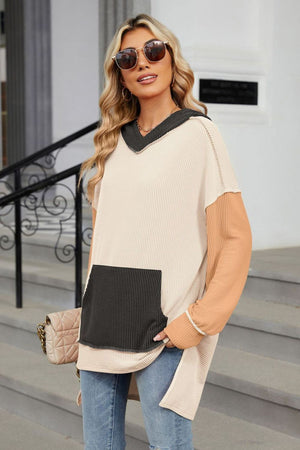 Beige waffle knit hoodie with contrast sleeves and black pocket