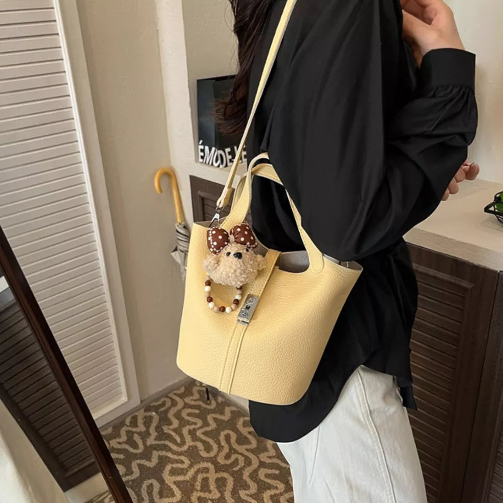 PU Leather Imported Size &amp crossbody bag in pale yellow with bucket silhouette