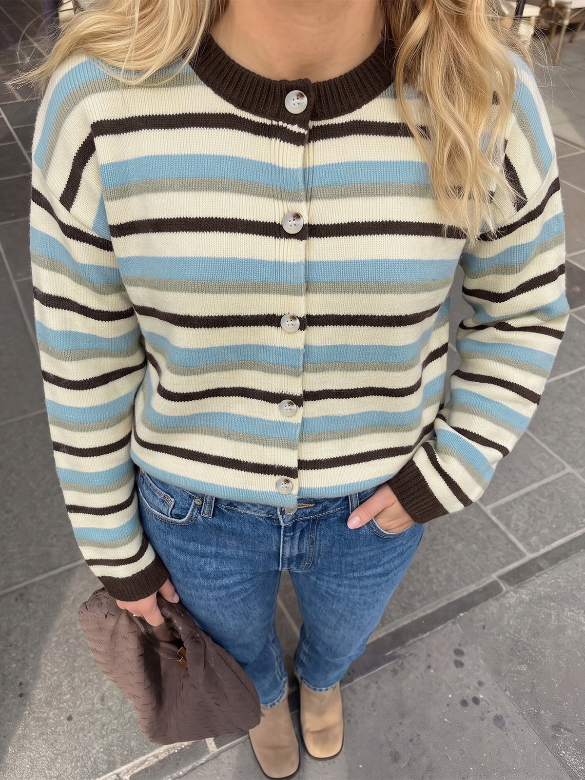 light blue cardigan featuring buttoned and striped