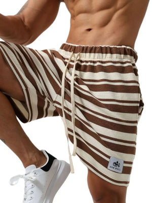 Brown and cream striped textured drawstring jogger shorts with a white drawstring.