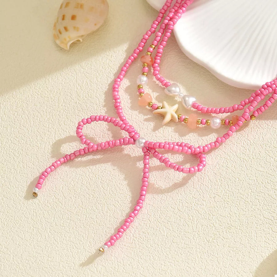 necklace in pink with three-layered and choker