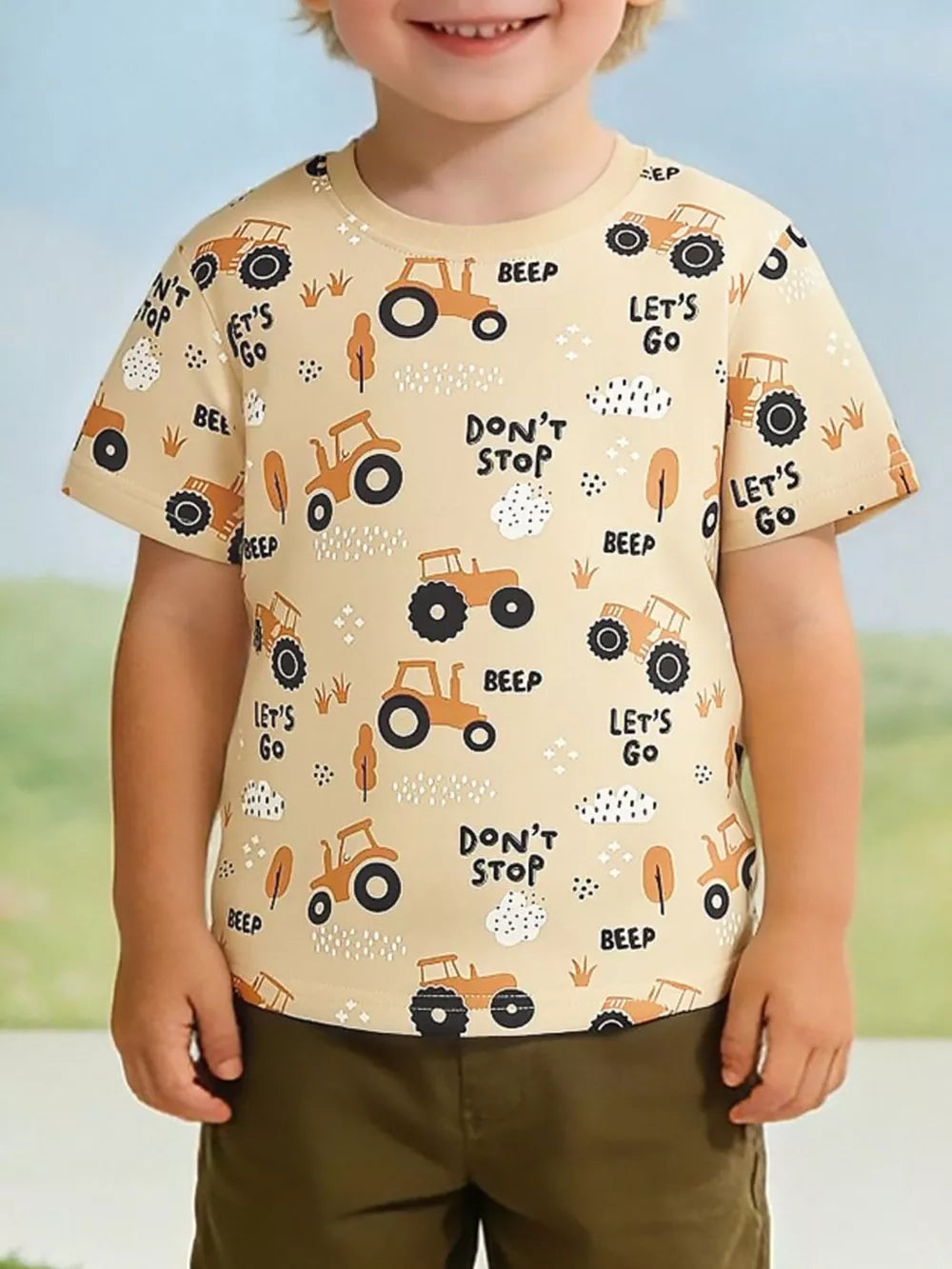 Toddler beige cotton t-shirt with playful tractor print, short sleeves, and crew neck.