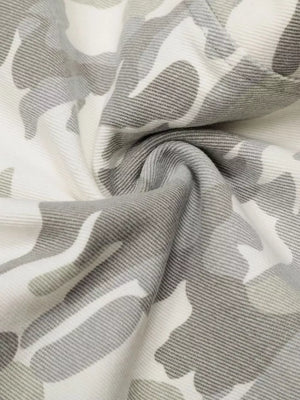 Camouflage wide-leg cargo pants in white and grey with a button fly and belt loops.