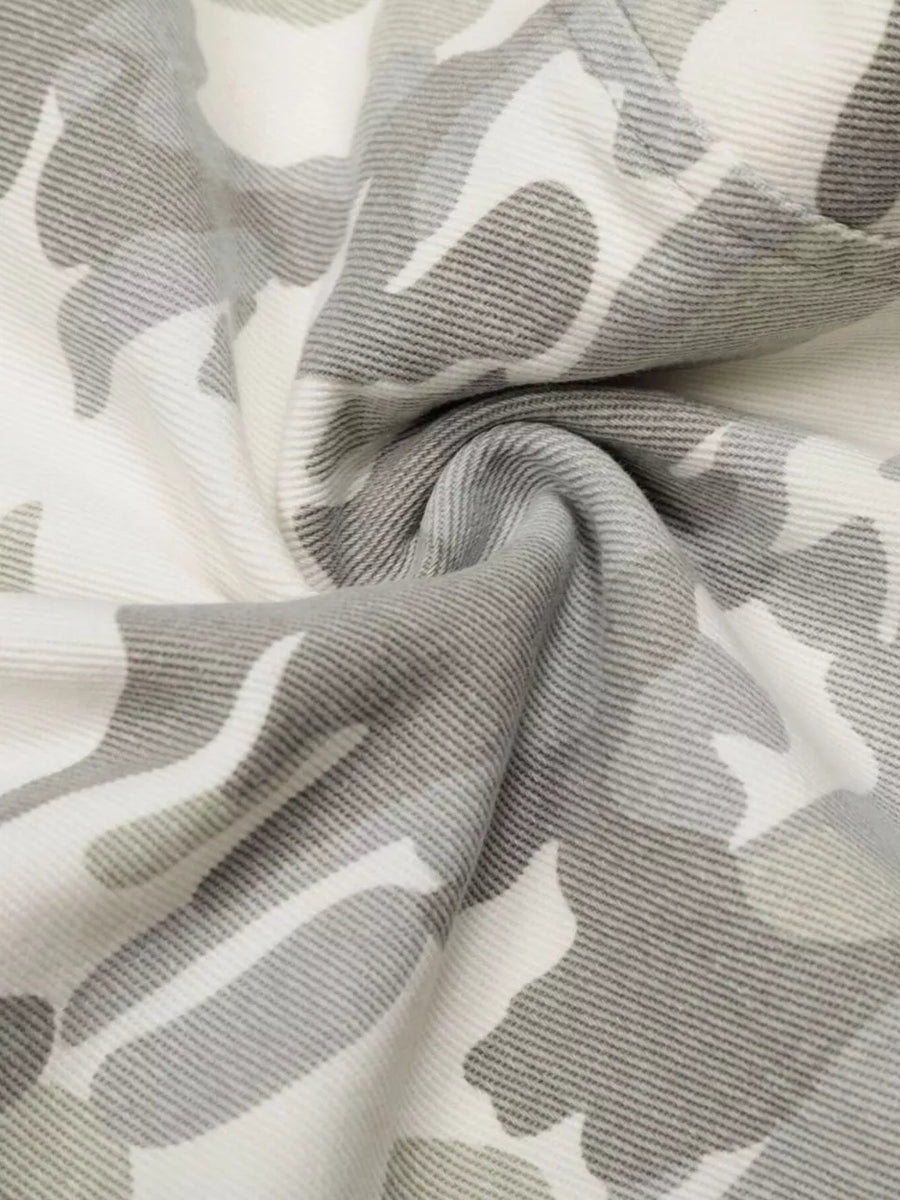 Camouflage wide-leg cargo pants in white and grey with a button fly and belt loops.