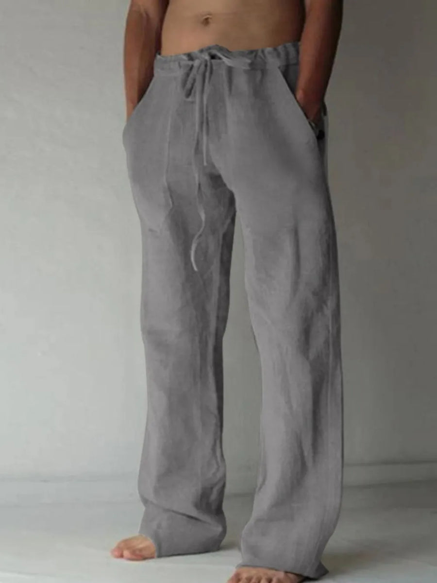 Gray linen blend wide-leg drawstring trousers with pockets.