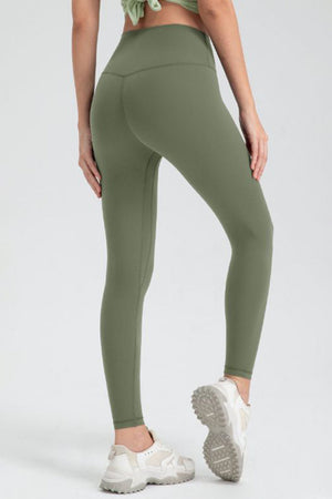 Matcha green high-waist performance leggings with sculpted seams and athletic fit.