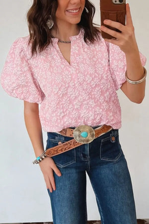 Textured floral puff sleeve shirt in blush pink with a V-neck and short sleeves.