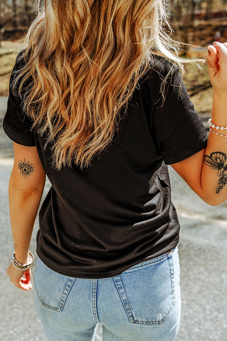 Black cotton t-shirt with distressed heart graphic, short sleeves, and crew neck.