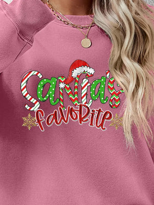 Blush Pink crewneck sweatshirt with Santa's Favorite graphic and snowflakes.