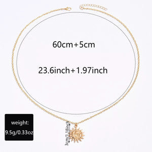 Gold sunburst pendant necklace with chain and size details shown.