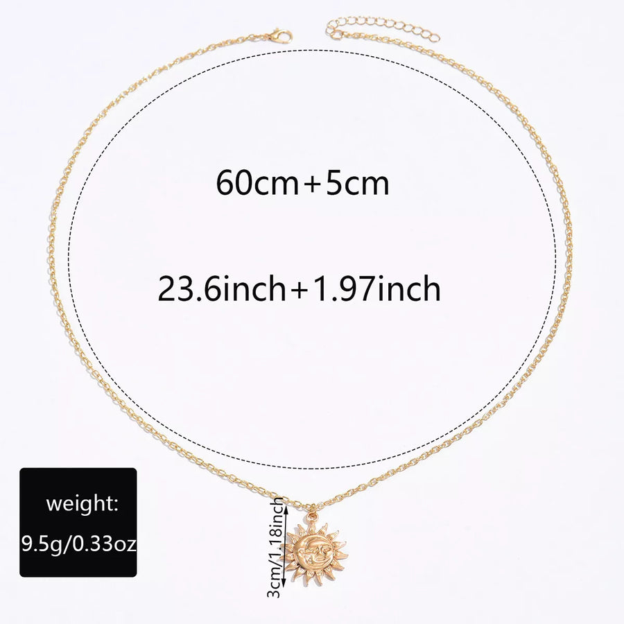 Gold sunburst pendant necklace with chain and size details shown.