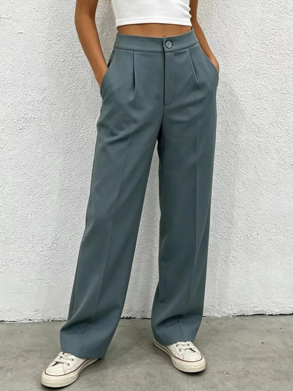 Chic high-waisted pleated maternity pants in slate blue with a button closure and wide leg.