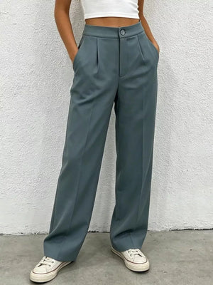 Chic high-waisted pleated maternity pants in slate blue with a button closure and wide leg.