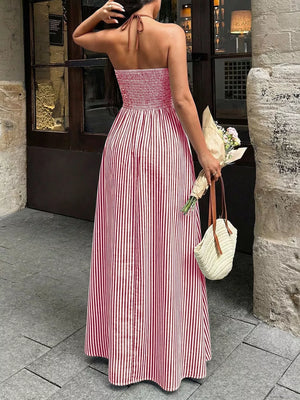 Elegant halter neck maxi dress in deep red and white stripes with smocked bodice.