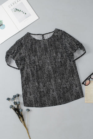Black micro-dot puff sleeve blouse with round neckline and short sleeves